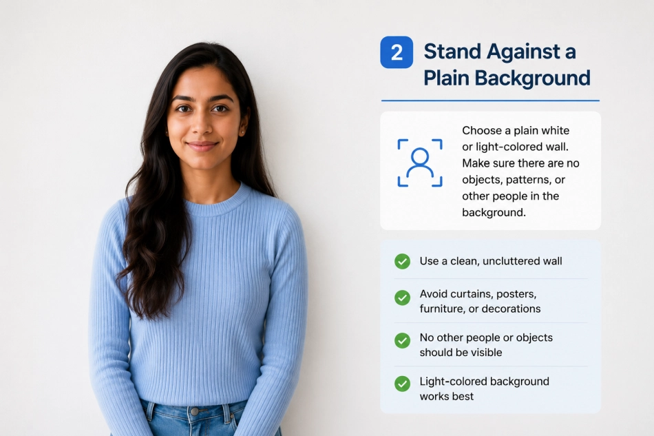 Standing against a plain background